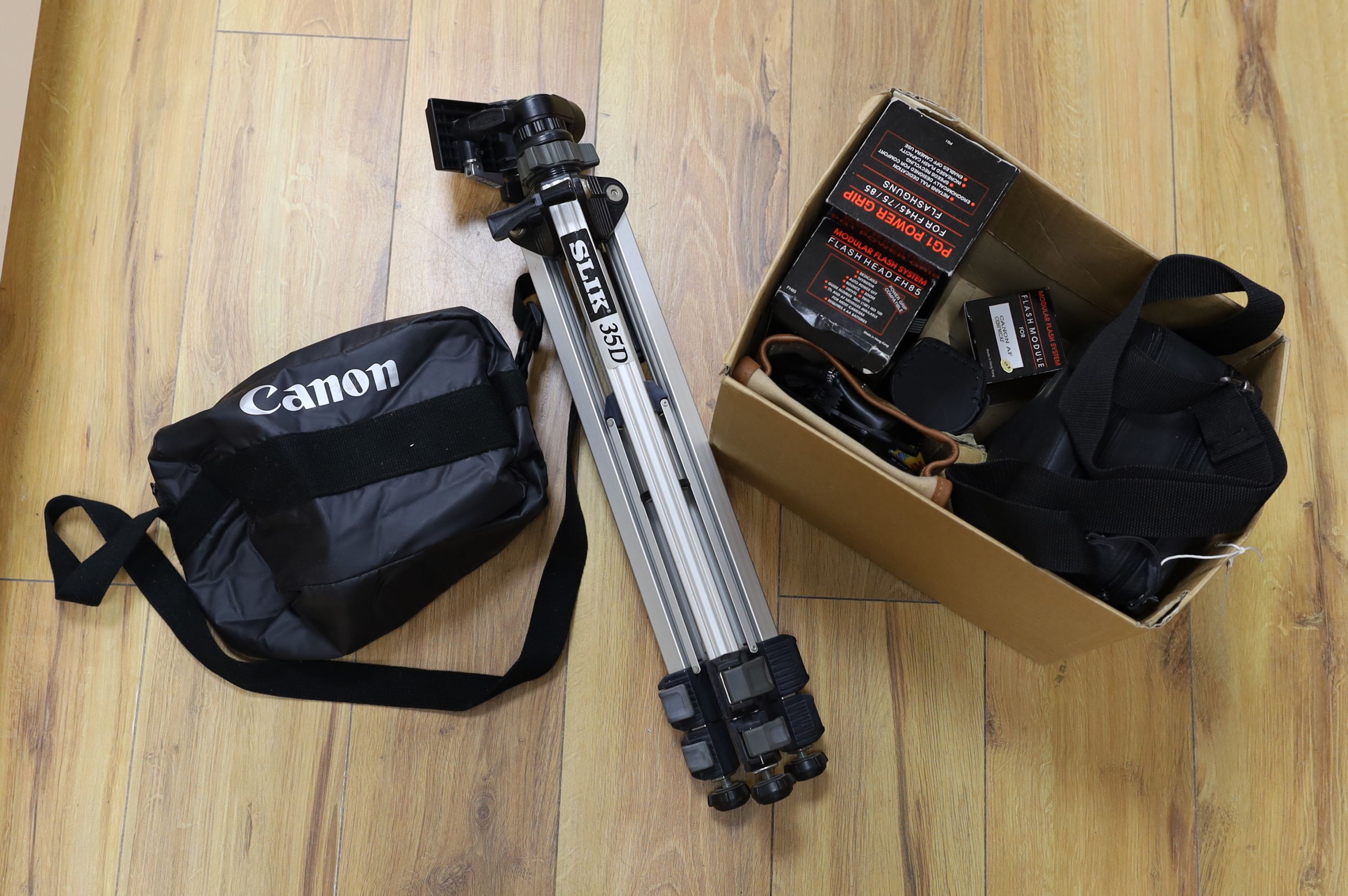 A collection of cameras, a tripod etc.